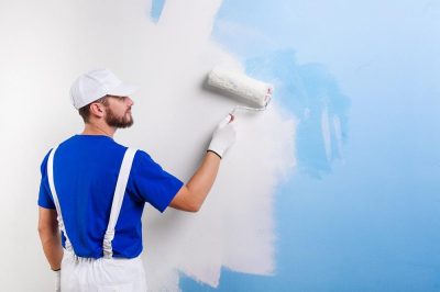 painter in white dungarees, blue t-shirt