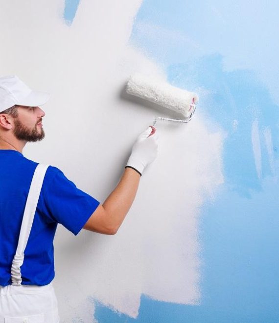 painter in white dungarees, blue t-shirt